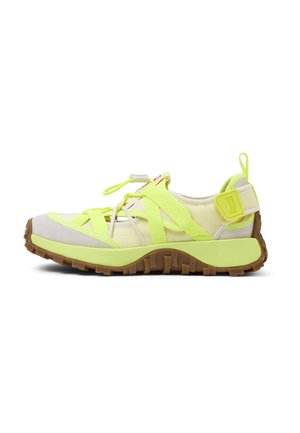 Lightweight sneaker with a cream upper, neon yellow accents, and a textured rubber sole. Features adjustable straps and a pull tab for easy wear.