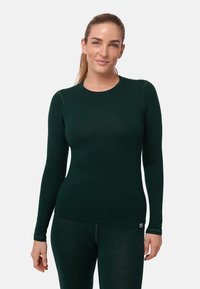 Termo tričko s dlouhým rukávem v tmavě zelené barvě, vyrobené z měkkého a pružného materiálu. Má kulatý výstřih a bezešvý design pro pohodlí.