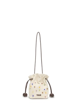 Small beige drawstring pouch with colorful bead accents, brown cords, and "TOUS" logo on front, shown against white background.