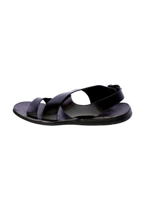 Sandal in pelle nera con cinturini incrociati, lati aperti e suola piatta. Presenta un cinturino posteriore per il supporto e una finitura liscia.