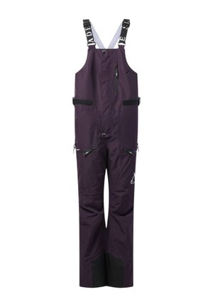 Pantalon salopette imperméable violet foncé avec bretelles noires et blanches ajustables, poches zippées et renforts noirs aux chevilles.