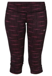 Leggings capri ajustés noirs à pois roses avec taille haute et logo Nike sur la partie supérieure de la cuisse.