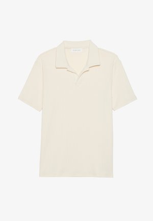 Polo-shirt à manches courtes de couleur crème avec un design à côtes texturé, présentant un col classique et des détails de couture subtils.