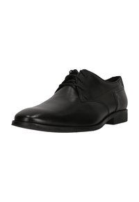 Chaussure habillée en cuir noir avec un bout arrondi, un laçage, une texture lisse et un talon bas. Présente un marquage minimal sur le côté.
