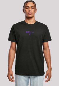 Black cotton t-shirt featuring purple Japanese text and a star design on the front. Short sleeves and a standard crew neck shape.