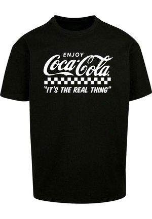 Črna bombažna majica s belim logotipom Coca-Cola in karirastim robom ter besedilom "TO JE PRAVA STVAR" v odebeljenem fontu spodaj.