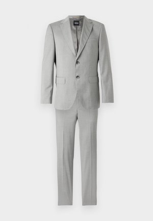 Hele halli ülikonnakomplekt, mis sisaldab kohandatud jakki, millel on lõigatud lõuaotsad, kaks nööpi ja siledad püksid. Sile kangas pehme tekstuuriga.