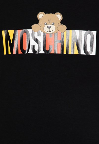 Black T-shirt featuring a cartoon bear peeking from above the word "MOSCHINO" in bold, colorful letters: red, yellow, and white.