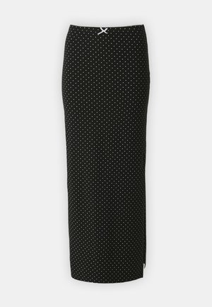 Juodas pieštuko sijonas su baltais taškeliais, pagamintas iš minkštos medžiagos. Turi prigludusį dizainą ir baltą akcentą juosmenyje.