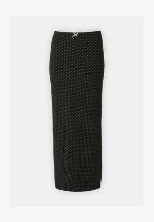 Melna zīmuļa svārki ar baltām punktiņām, izgatavoti no mīkstas auduma. Ievērojama pieguļoša forma un balta akcenta detaļa jostasvietā.