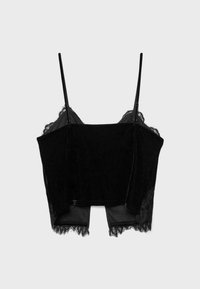 Black velvet cropped camisole with adjustable thin straps and lace trim at the neckline and hem.