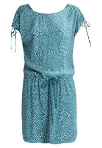 Turkooise jurk met witte stippen, korte mouwen, taille met trekkoord en geplooide details bij de schouders. Gemaakt van lichtgewicht stof.