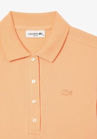 Lacoste Piké - orange clair ixy