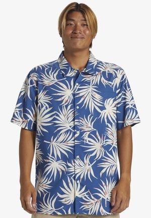 Short-sleeve button-up shirt in blue fabric with white palm leaf pattern and light pink accents. Features a pointed collar and front buttons.
