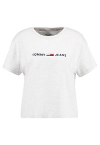 T-shirt bianca in cotone con maniche corte, con la scritta "TOMMY" e "JEANS" in blu navy. Vestibilità casual con scollo tondo.