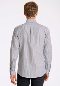 Gray and white striped button-up shirt with long sleeves, a standard collar, and a straight back yoke detail. Fabric has a smooth texture.
