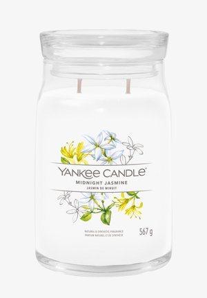Yankee Candle-pot met twee lonten, gelabeld Midnight Jasmine, versierd met gele en witte jasmijnbloemen, weegt 567 gram.