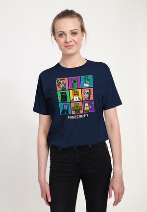 Navy blue cotton t-shirt featuring a grid of Minecraft characters in various colors. Graphic print includes pixelated designs and logo.