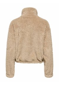 Pull polaire en beige doux, avec un col montant, une coupe courte et un extérieur texturé et duveteux. Aucun élément métallique ou accent visible.