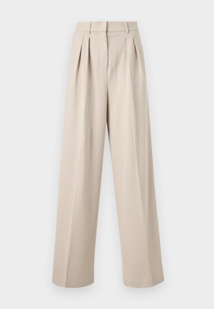 Kõrge vöökohaga beežid laiad püksid esitelgedega, vööaasadega ja peidetud esiosaga kinnitusega.