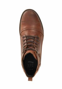 Brown leather ankle boot with a round toe, flat laces, and a pull tab. Features contrasting stitching and a padded collar for comfort.