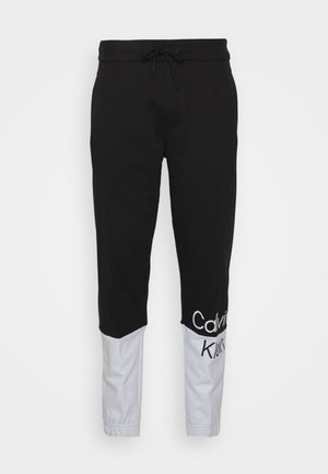 INSTITUTIONAL BLOCKING UNISEX - Tracksuit bottoms - black