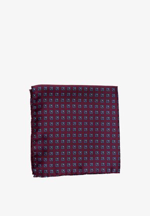 Tumepunane taskurätik, millel on korduv mustriga väikseid siniseid ruute, mis on paigutatud ruudustikuna.