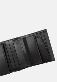 Black leather wallet with multiple card slots, smooth texture, and elastic strap for secure closure. Compact and rectangular shape.