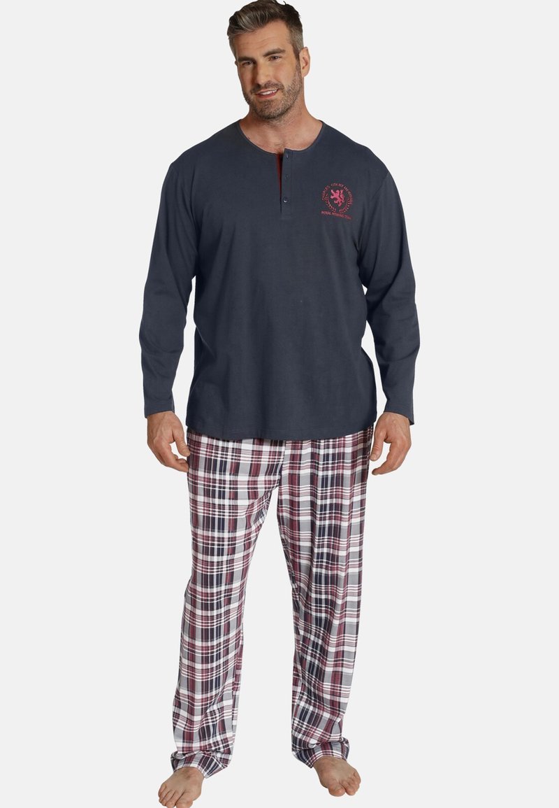 Men's pajama set featuring a dark gray henley top with a red logo, and plaid pants in red, white, and navy. Cotton fabric, relaxed fit.