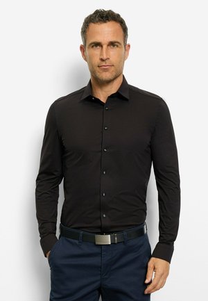 Black long-sleeve shirt with a classic collar, button-front closure, and black buttons, paired with a dark blue belt and trousers.