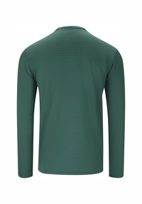 Langarmshirt in dunkelgrün, aus glattem Stoff mit einer feinen Rippstruktur. Rundhalsausschnitt, ohne sichtbare Logos oder Verzierungen.