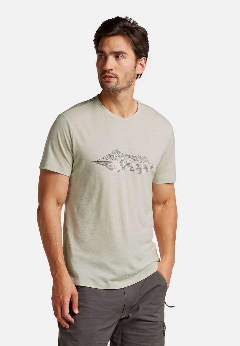 Light green cotton t-shirt with a round neckline and short sleeves, featuring a black mountain and water line graphic on the front.