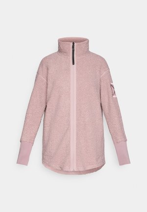 Fleecový pulover vo svetloružovej farbe, s vysokým golierom, predným zipsom a kontrastnými manžetami. Hladký a plyšový materiál s voľným strihom.