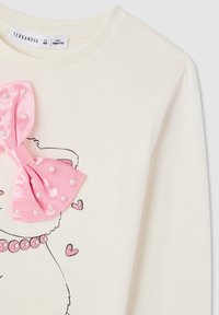 Camicia bianca a maniche lunghe con un fiocco di satin rosa decorato con perle, caratterizzata da un simpatico design stampato e dettagli scintillanti.