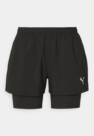 Zwarte sportshorts van lichtgewicht stof, met een elastische tailleband, binnenste compressievoering en zilveren logodetail.