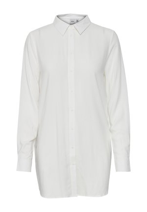 Vit långärmad skjorta med knappar, spetsig krage, uppvikta ärmslut och rak fåll.