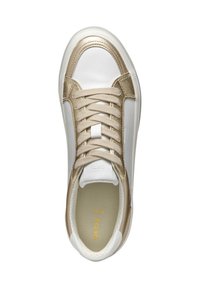 White sneakers with gold accents, featuring a smooth material, round toe, and flat laces. Interior shows a padded insole with logo.