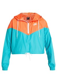 Avkortad vindjacka med en ljus orange ovandel och turkos nederdel, med halvdragkedja, huva och justerbar dragsnodd i kanten.