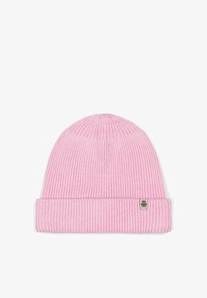 Pink ribbed knit beanie with folded cuff and small rectangular tag on cuff's right side.