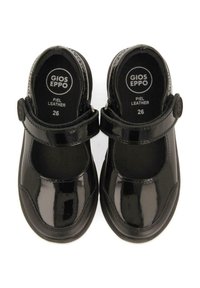 Zapatos Mary Jane de charol negro con punta redonda, correa ajustable y suela de goma texturizada. Talla 26, etiquetado en el interior.