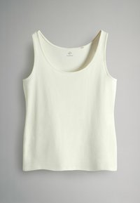 Maiou de crem deschis din țesătură moale, cu decolteu rotund, bretele late și tiv drept. Design simplu, fără ornamente.