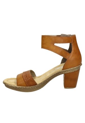 Tan leather heeled sandal featuring a textured band, open heel design, and woven detailing on the platform. Ideal for casual wear.
