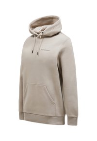 Beige huppari, jossa on nyöri, etutasku ja ribbikuvioidut hihansuut. Tasainen pinta, jossa on huomaamaton logo yksityiskohtana rinnassa. Rennon tyylinen.