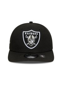 Black snapback cap with a curved brim, featuring an embroidered Raiders logo in black, white, and silver on the front.
