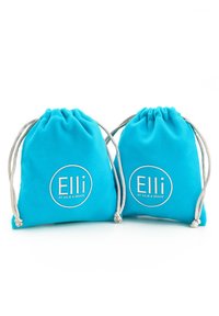 Two drawstring bags in vibrant turquoise fabric, featuring a circular logo with "Elli" and "by Julie & Grace" in white text and silver accents.