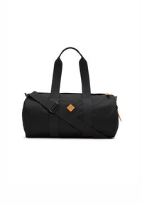 Black duffle bag made of durable fabric, featuring two short handles, a long adjustable strap, and a leather patch logo. Zippered compartment.