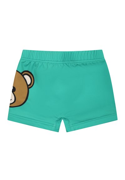 Costumi da bagno turchesi con cintura elastica, caratterizzati da una grafica di un orso bruno sul lato sinistro. Materiale liscio e leggero.