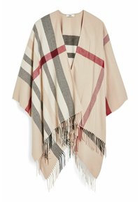 Poncho ouvert beige avec de larges rayures rouge, noir et blanc et des bords à franges tombant droit.