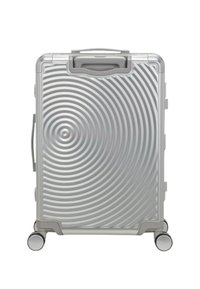 Valigia rigida argentata con scanalature circolari concentriche, maniglia superiore, maniglia laterale e quattro ruote per la mobilità.