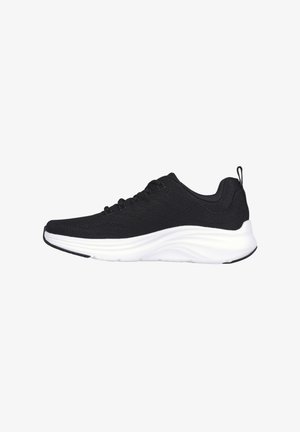 Black athletic shoe with a textured mesh upper, laces for adjustment, and a thick white cushioning sole. Includes a pull tab at the heel.
